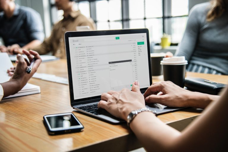 Person Composing Email Using Macbook Pro