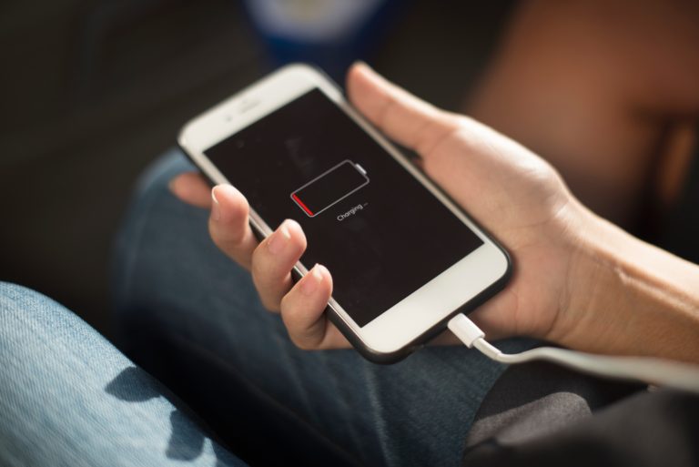 Person Holding Mobile While Charging