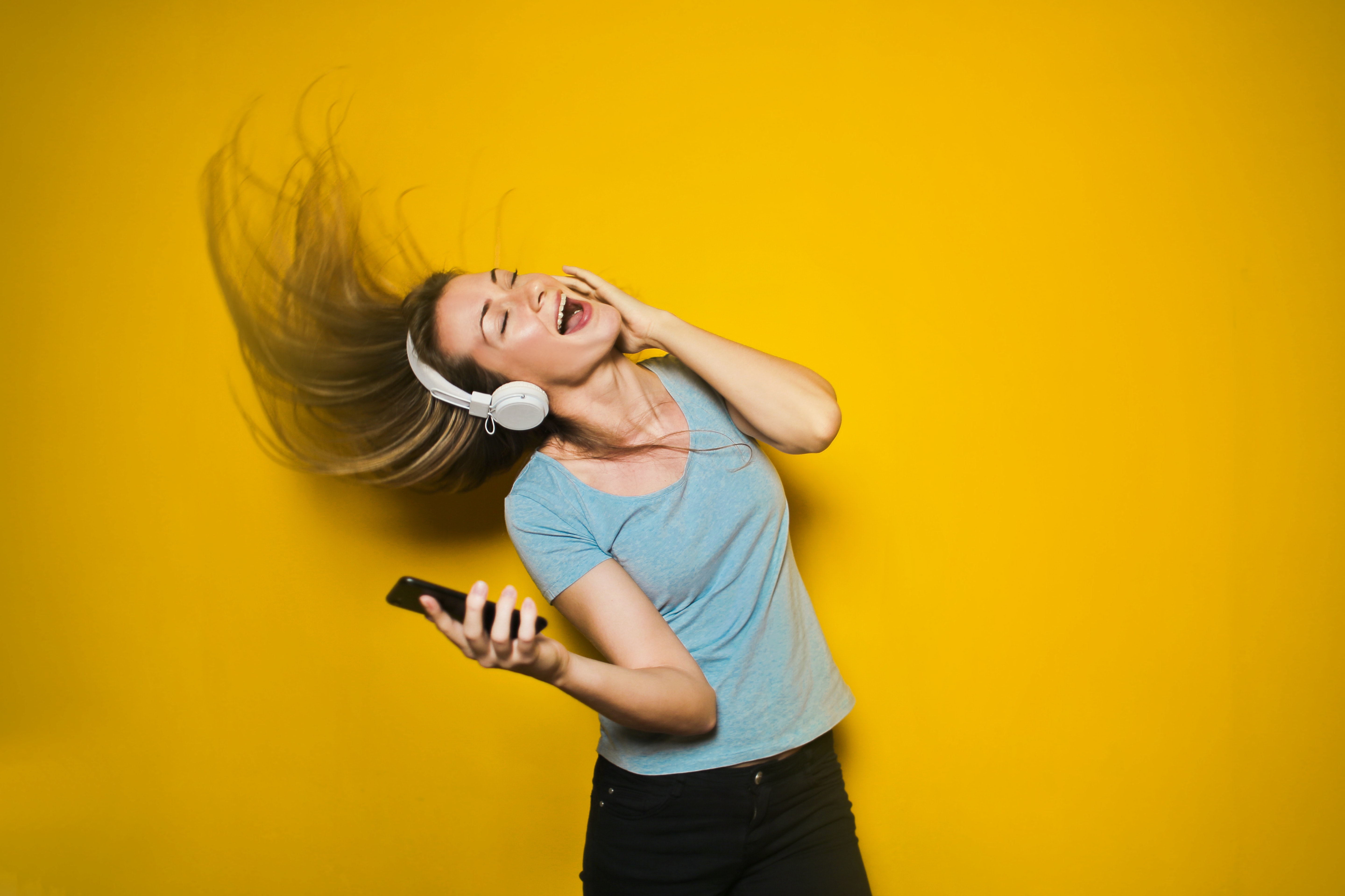 Photo of Woman Listening to Music