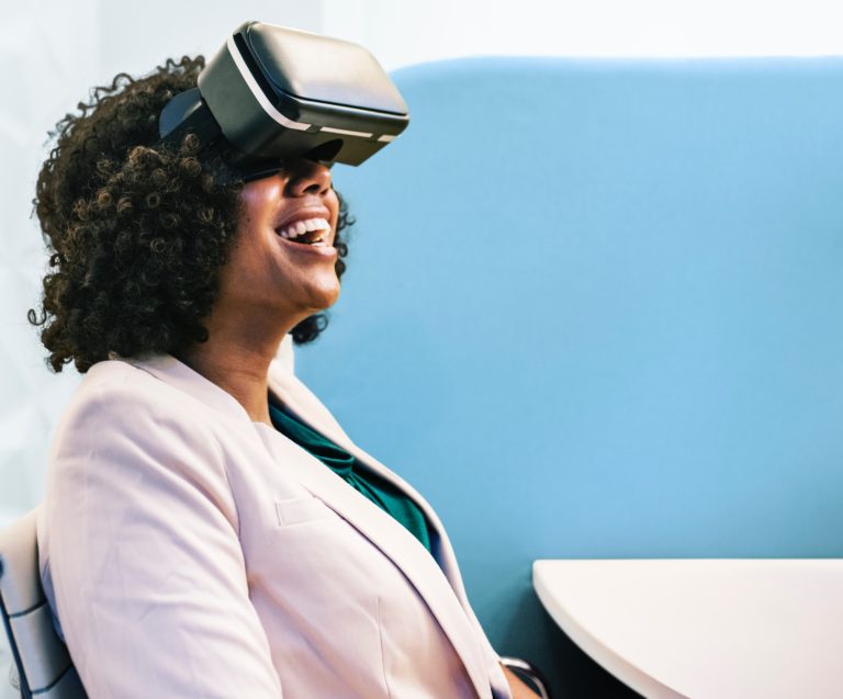 Woman Wearing White Robe & Black Virtual Reality Headset